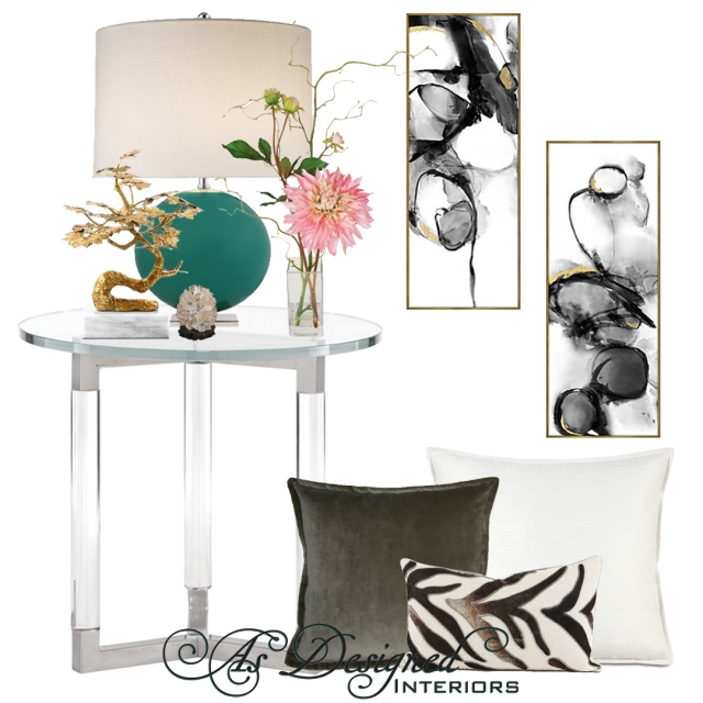 Modern clear end table with a jade colored lamp with a gold bonsai tree, mica pine cone, and floral arrangement. Tie in the rest of the room with abstract black and gold and some pillows for a modern, elegant look.