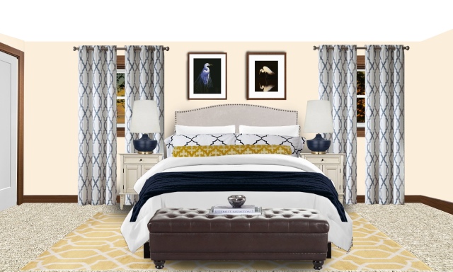 Bedroom in creamy yellows and dramatic navy blue.